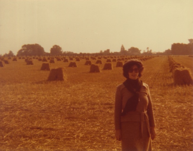Madeline with haystacks in France